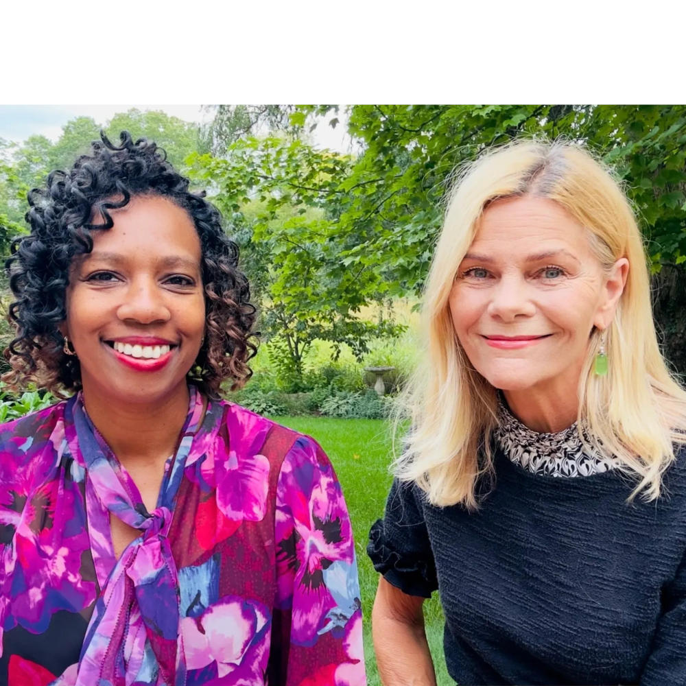 Dr. Lisa Kohut and Shelly Lawler smiling outdoors with greenery behind.
