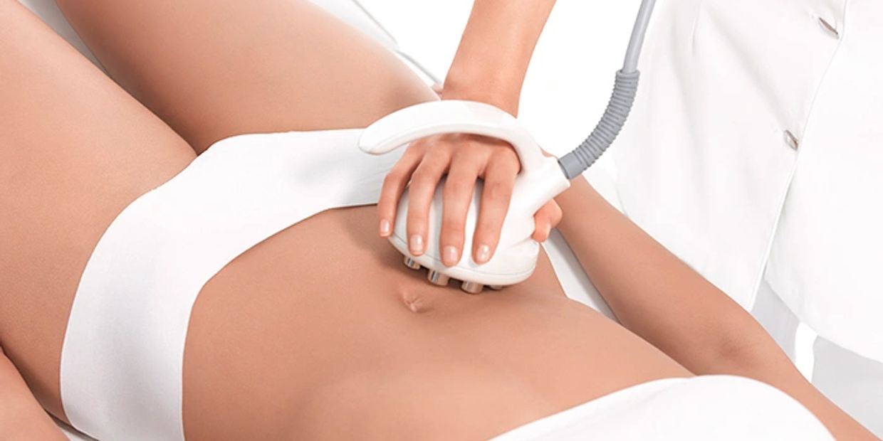 Body contouring being performed on woman's abdomen