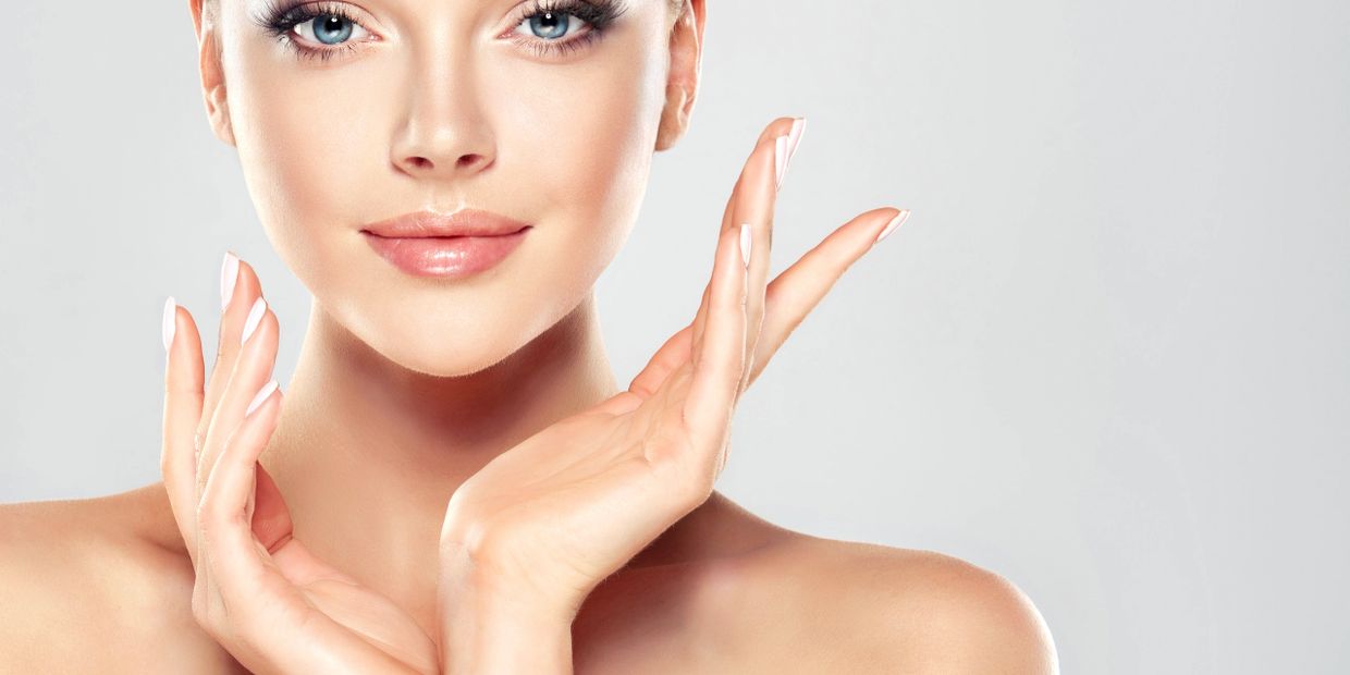 woman's face with hands contouring her cheeks