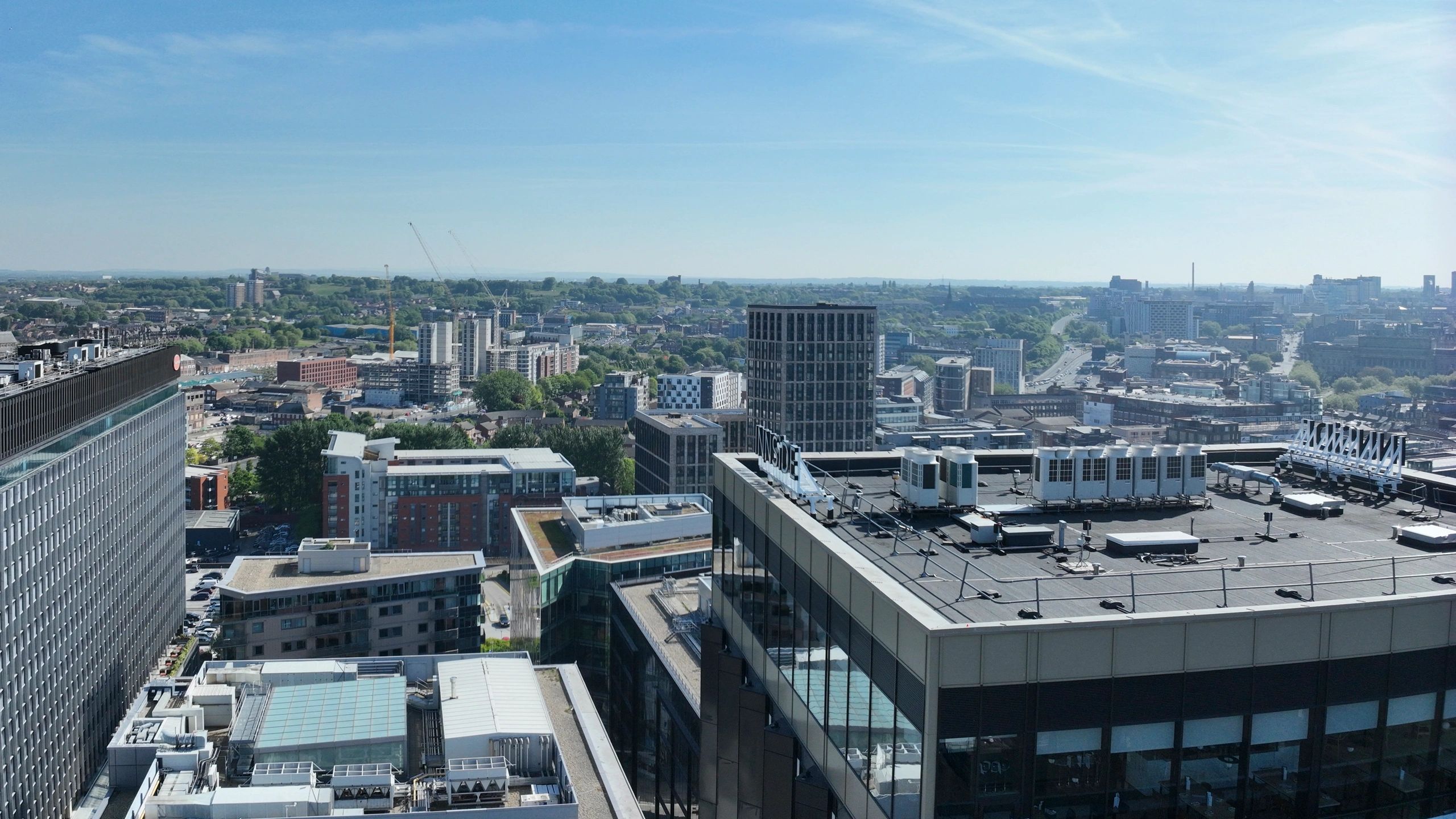 Cityscape with modern building which is about to be surveyed and clear blue sky on a sunny day.
