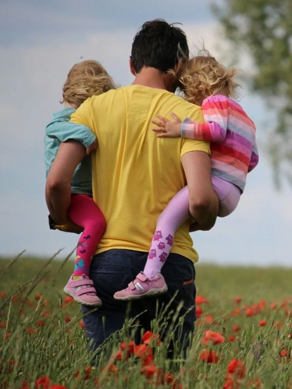 Parent carrying children