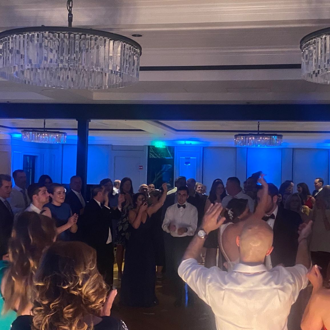 People dancing and having fun at an indoor party.