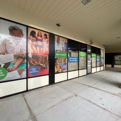 a store front medical center windows with graphics