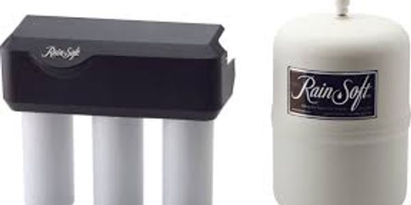 RainSoft water filtration system with filter unit and storage tank.