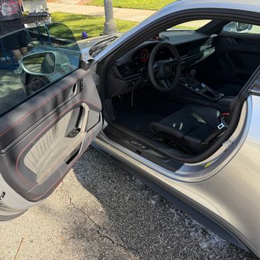 Exterior paint correction and ceramic coating results on silver sports car in Sherman Oaks