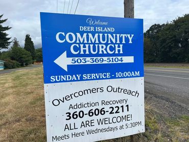 Sign for Deer Island Community Church and Overcomers Outreach addiction recovery program.