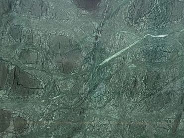 Close-up of textured green marble surface with natural veins.