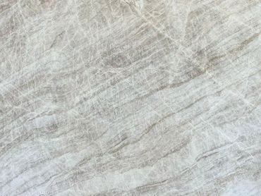 Close-up of a textured gray marble surface with natural veins.