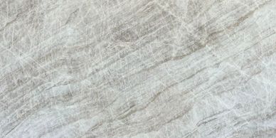 Close-up of a textured stone surface with natural gray and white veining.