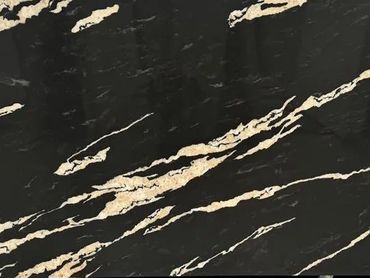 Large black marble slab with beige streaks held upright indoors.
