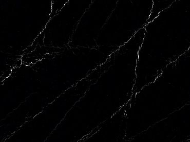 Black marble slab with white veining on wooden supports.