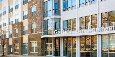 Modern brick and glass apartment building entrance.