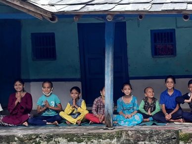 Children of Rakkar practice morning yoga and  meditation