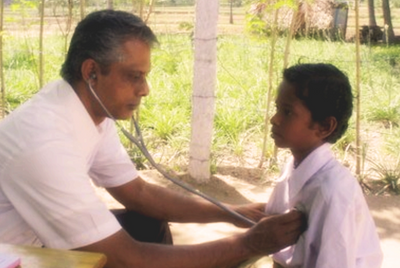 Dr. Chinnaiyan conducting a leprosy relief camp in a government school in Rural Salem, 1999.