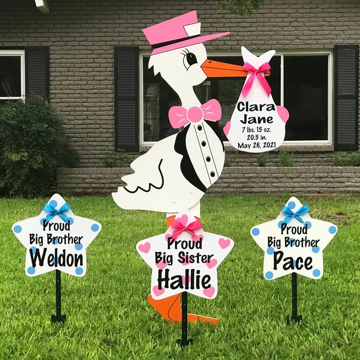 Stork yard sign with customized baby  announcement.  Star yard signs with customized sibling info.