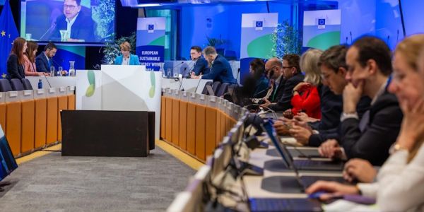 People attending a European Sustainable Energy Week conference.