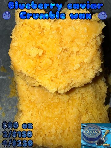 Close-up of yellow crumbly wax labeled Blueberry Caviar Crumble.