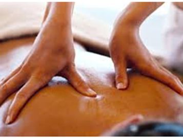 Hands giving a back massage.