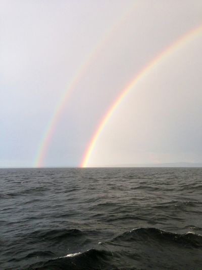Double rainbow over the ocean.