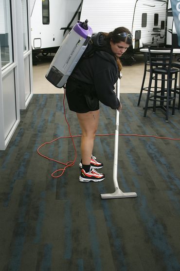 cleaning technician vacuuming at a retail store in eau claire wi