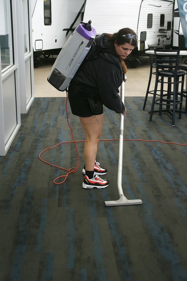 cleaning technician vacuuming at a retail store in eau claire wi