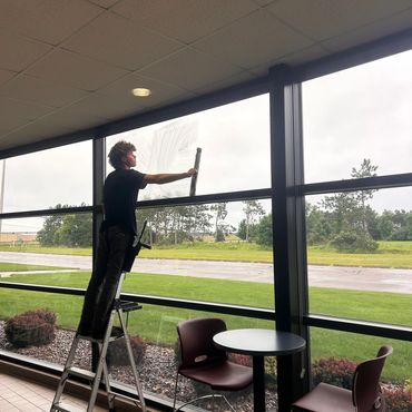 technician window cleaning at CVTC Chippewa Falls