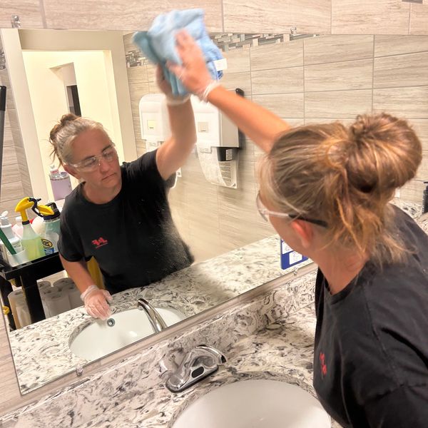 Janitorial technician cleaning office space in Lake Hallie, WI