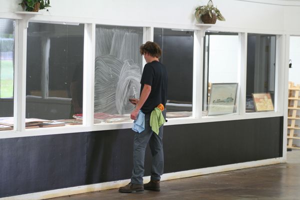 crew technician washing windows at the northern wisconsin state fairgrounds
