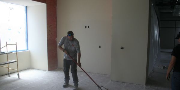 j & f facility services team member cleaning a construction site in eau claire 