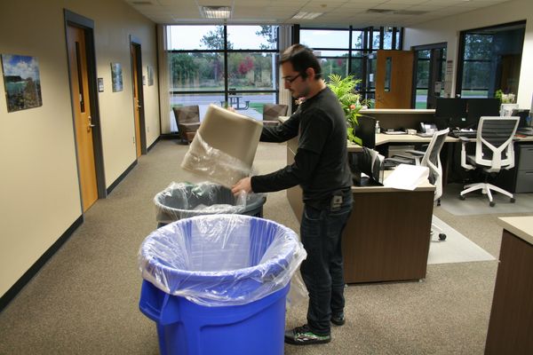 j & f facility services technician emptying trash cans for a college campus in chippewa falls wi