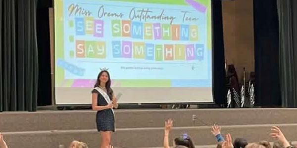 Miss Orem's Teen presenting her service initiative.