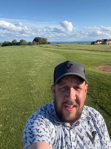 Greg on a golf course