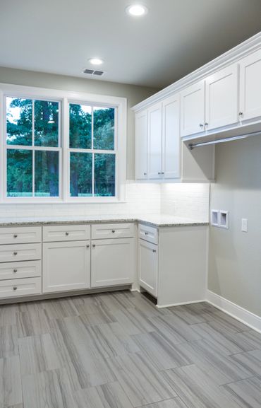 An all-white room with a window