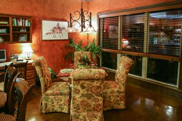 Vintage chairs and a table beside the window