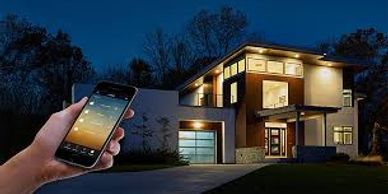 Smartphone controlling lights of a modern house at night.