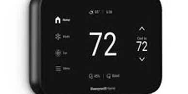 Smart thermostat displaying a temperature of 72 degrees.
