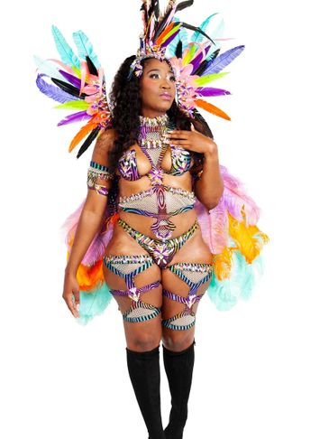 Woman in colorful carnival costume with feathers and beads.