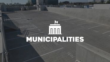 Empty parking lot with 'Municipalities' text overlay.