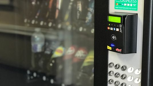 Refrigerated combination drink and snack vending machine