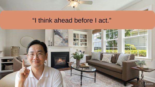 Man in white shirt gestures thoughtfully in a cozy living room with a fireplace.
