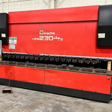 Large red Amada HFE 220-4S industrial press brake machine.
