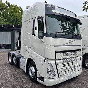 White Volvo semi-truck parked outdoors.