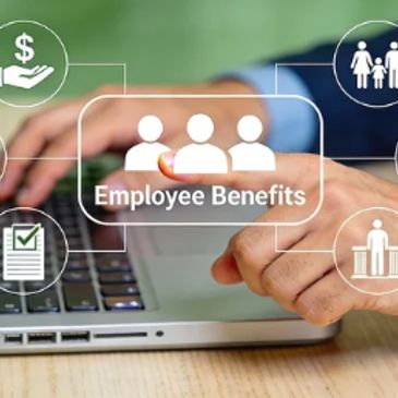 Person interacting with a laptop displaying employee benefits icons and text.