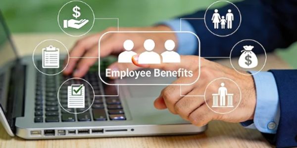 Person interacting with a laptop displaying employee benefits icons and text.