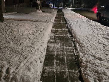 Cleared the sidewalk with a snowblower, creating a wide and safe path for pedestrians.