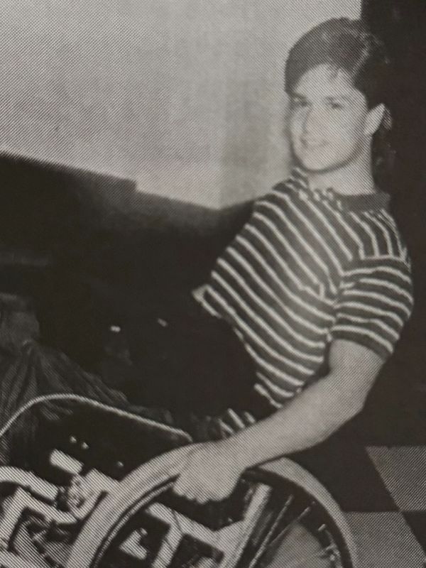 Image of a young Tom Shaw in a wheelchair after his accident.