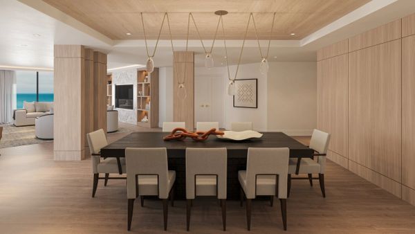 Modern dining area with wooden elements and stylish lighting.