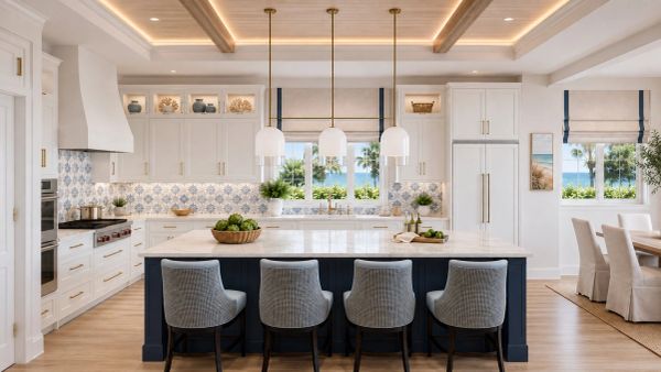Bright modern kitchen with island and ocean view.