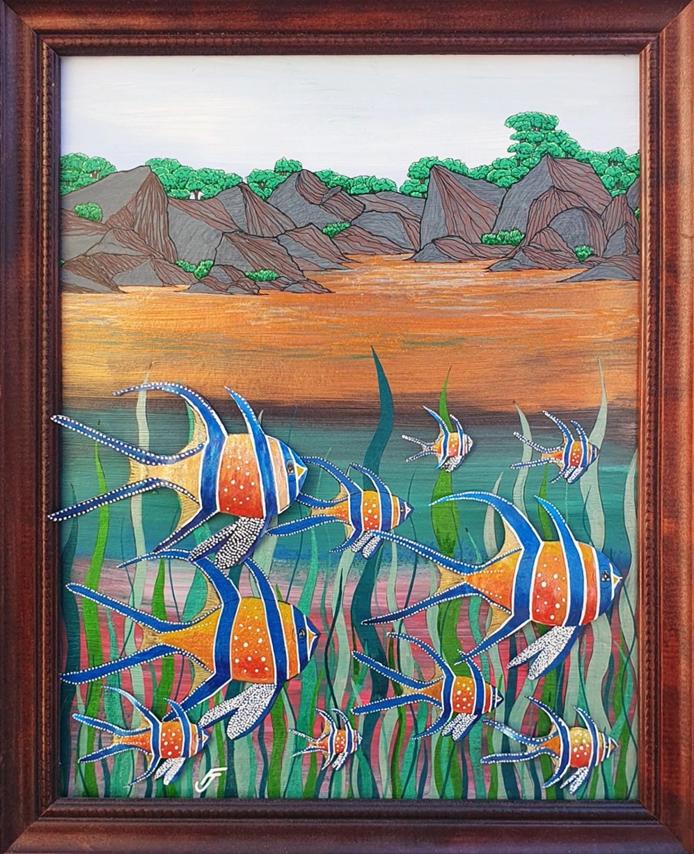 School of Fish A painting of a rocky shore with fish and reeds below. Some of the fish paper cutouts