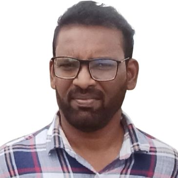Man wearing glasses and plaid shirt.